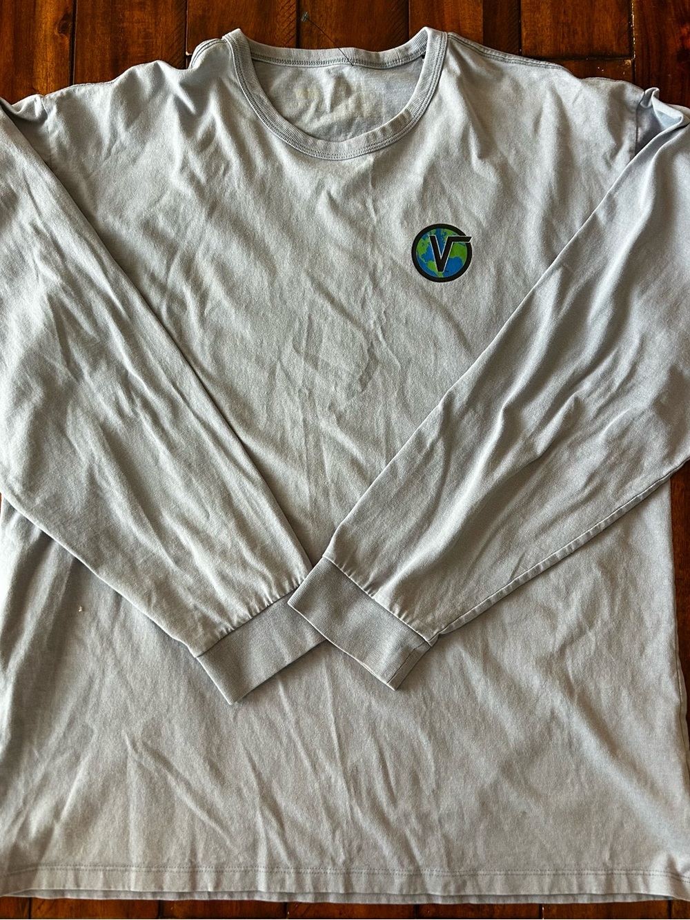 Light Blue Long Sleeve Tee with Small Green & Blue Logo